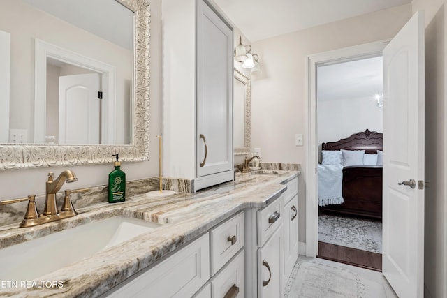 full bath featuring ensuite bathroom and double vanity