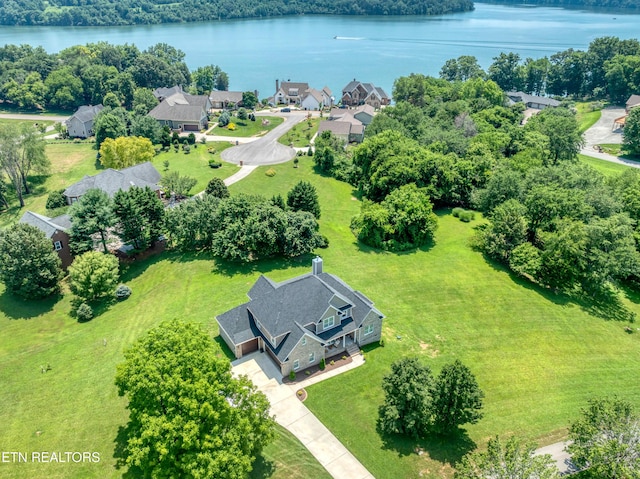 aerial perspective of suburban area with a nearby body of water