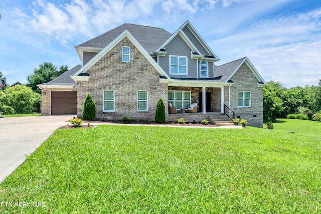 craftsman-style house featuring covered porch, a shingled roof, driveway, and an attached garage