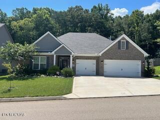 2368 Waterstone Blvd, Knoxville, TN 37932 - view of front of house featuring driveway, a front lawn, and a garage