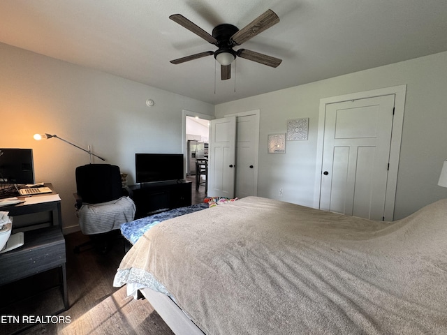 1353 Roy Owens Rd, Jamestown, TN 38556 - bedroom with wood finished floors, stainless steel refrigerator with ice dispenser, and ceiling fan