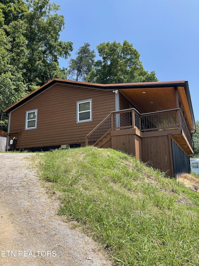 1908 Inskip Ln, Dandridge, TN 37725 - back of property with stairway and a wooden deck
