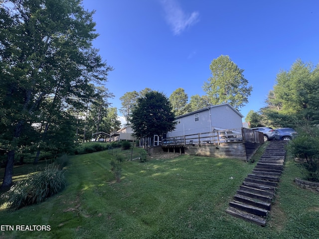 2011 Cedar Ln, Corbin, KY 40701 - view of green lawn featuring stairs and a wooden deck