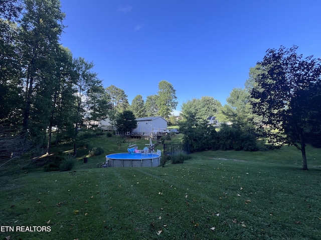 2011 Cedar Ln, Corbin, KY 40701 - view of grassy yard with an outdoor pool