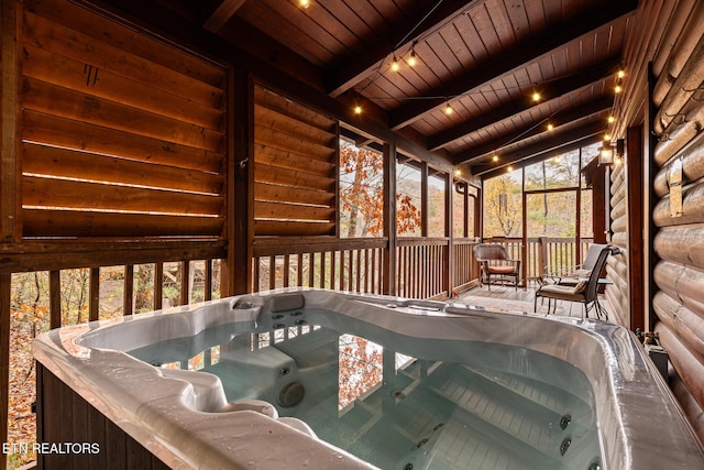 716 Golden Eagle Way, Pigeon Forge, TN 37863 - sunroom / solarium featuring a hot tub and beam ceiling