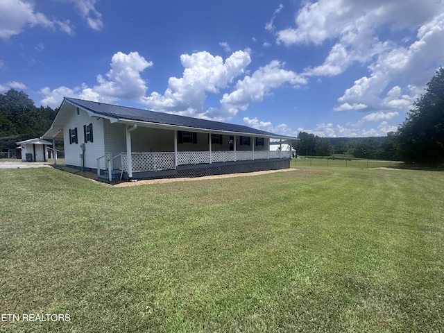 190 NW Glensara Dr, Charleston, TN 37310 - back of property with a metal roof and a carport