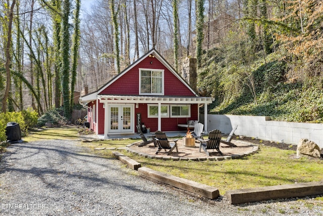 335 Sugar Mountain Way, Pigeon Forge, TN 37863 - view of front of house with french doors and an outdoor fire pit