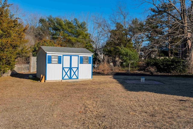 view of shed with fence