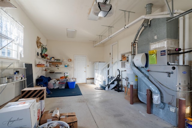 garage with a garage door opener and gas water heater