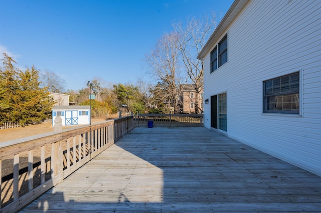 deck with an outdoor structure and a storage unit