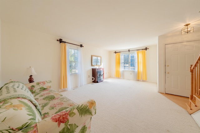 bedroom featuring light colored carpet