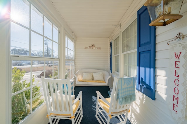 sunroom / solarium featuring a healthy amount of sunlight