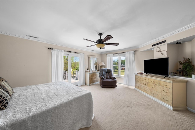 bedroom with multiple windows, light carpet, access to exterior, and ceiling fan