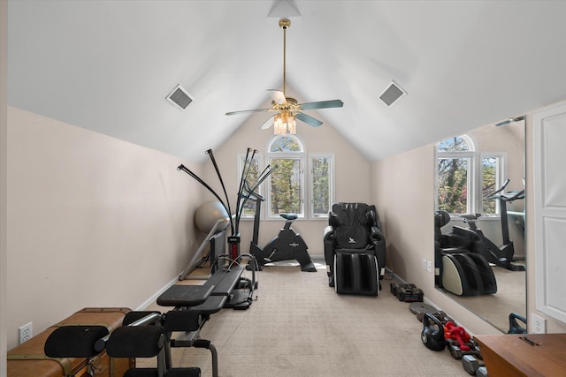 exercise room featuring ceiling fan, a healthy amount of sunlight, light colored carpet, and lofted ceiling