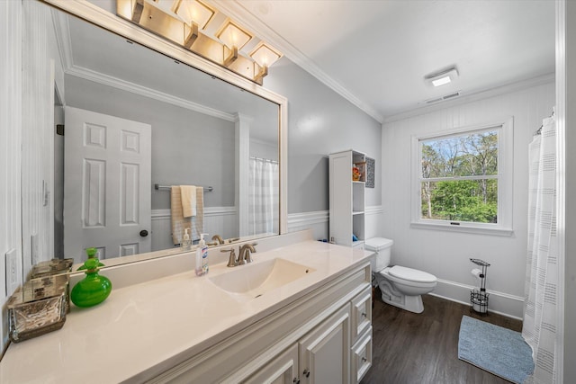 bathroom featuring vanity, toilet, wood-type flooring, and crown molding