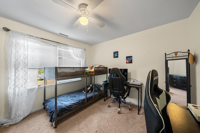 bedroom with light carpet and ceiling fan