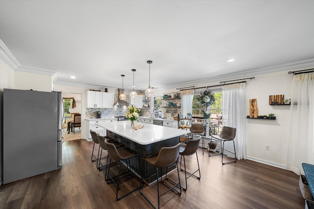 dining room with ornamental molding and dark wood-type flooring