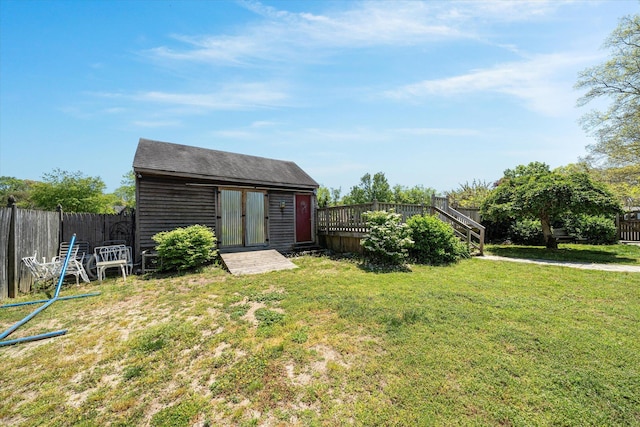 view of yard featuring a shed and a wooden deck