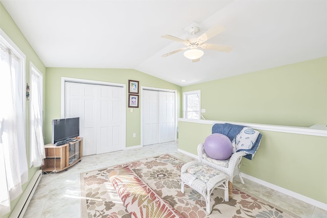 sitting room featuring a baseboard radiator, baseboards, ceiling fan, and vaulted ceiling