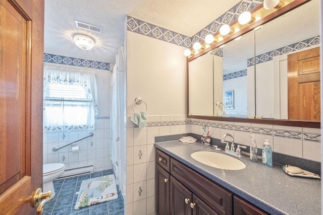 full bath featuring visible vents, toilet, a textured ceiling, tile walls, and baseboard heating