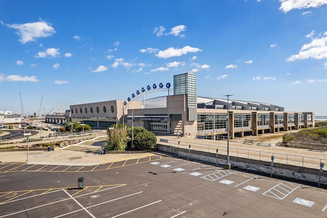 view of building exterior featuring uncovered parking