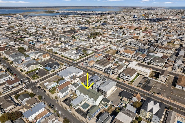 bird's eye view featuring a residential view and a water view