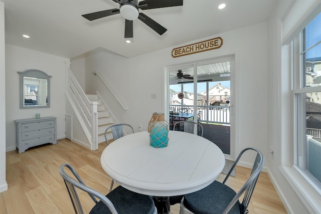 dining space with light wood-style flooring, stairway, recessed lighting, and ceiling fan
