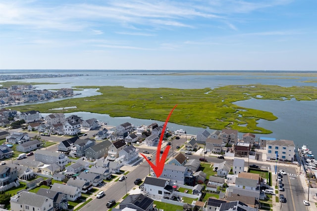 bird's eye view featuring a water view and a residential view