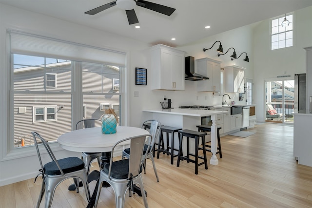 dining space with recessed lighting, light wood finished floors, and ceiling fan