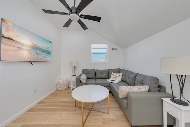 living room featuring ceiling fan, light wood finished floors, baseboards, lofted ceiling, and visible vents