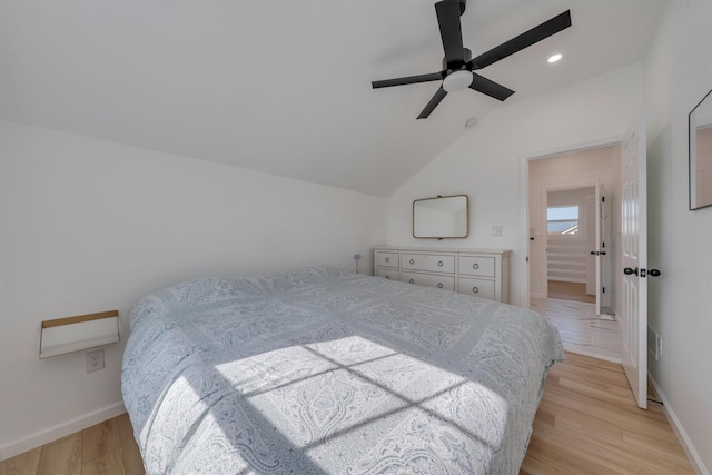 bedroom featuring light wood finished floors, vaulted ceiling, baseboards, recessed lighting, and ceiling fan