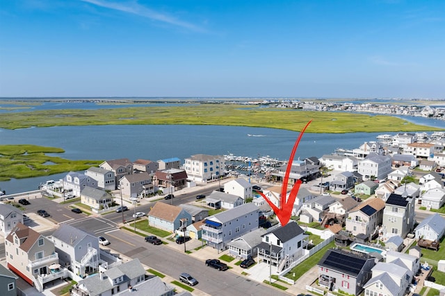 aerial view with a residential view and a water view
