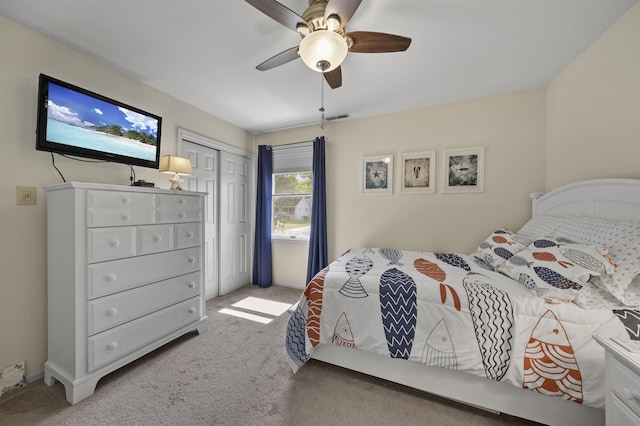 carpeted bedroom with a closet and ceiling fan