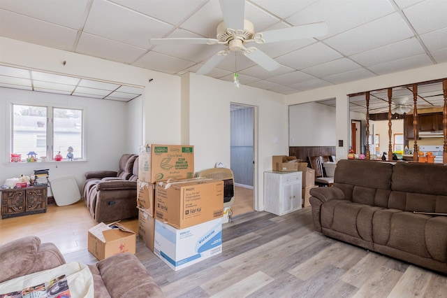 living room with ceiling fan and wood-type flooring