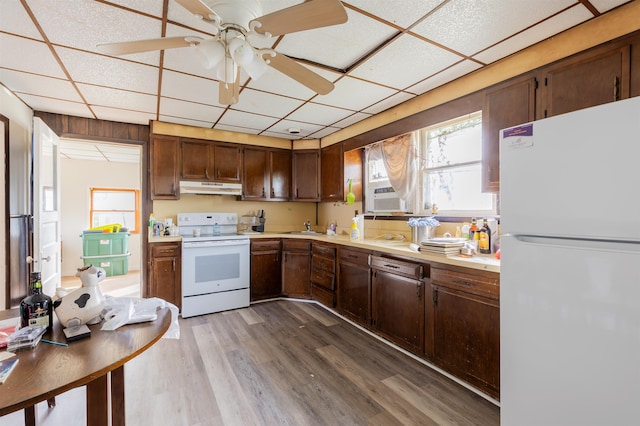 kitchen featuring a paneled ceiling, white appliances, cooling unit, ceiling fan, and dark hardwood / wood-style floors