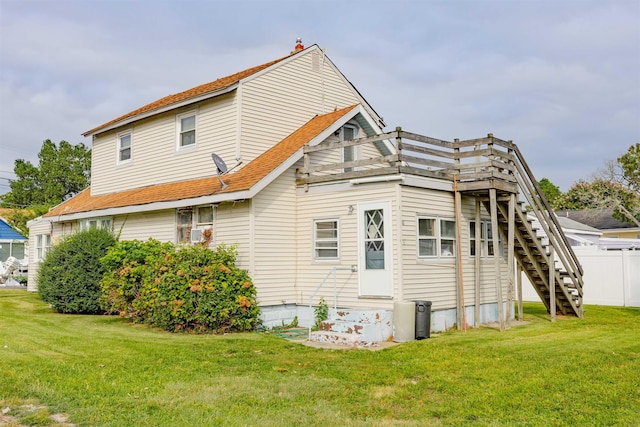 back of property featuring a yard