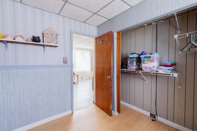 hallway with light hardwood / wood-style flooring