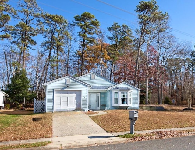 view of front of property featuring a garage and driveway