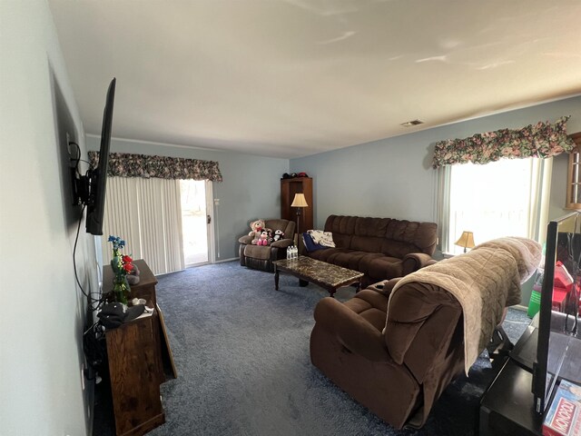 living room with carpet flooring and visible vents