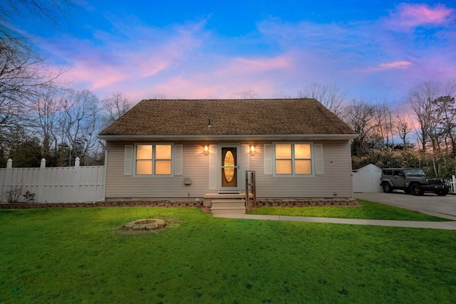 view of front of home with a lawn