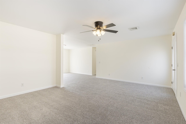 spare room featuring light carpet and ceiling fan