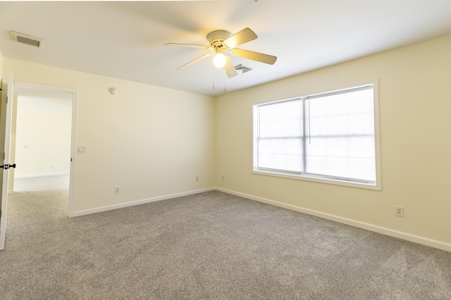 empty room with light carpet and ceiling fan