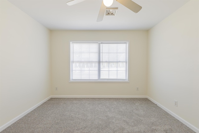 unfurnished room with carpet and ceiling fan