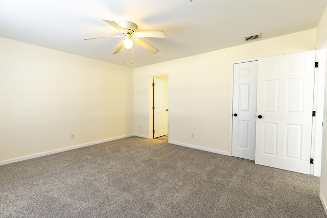 unfurnished bedroom featuring ceiling fan, carpet floors, and a closet