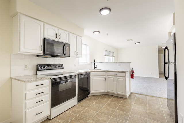 kitchen featuring white cabinetry, sink, backsplash, light colored carpet, and black appliances