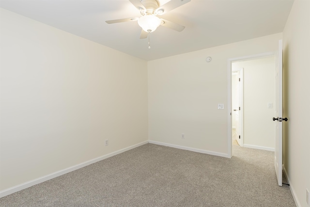 empty room with light carpet and ceiling fan