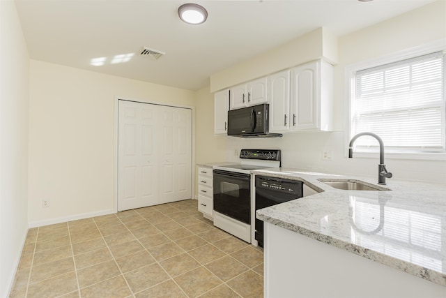 kitchen featuring light tile patterned flooring, sink, black appliances, light stone countertops, and white cabinets