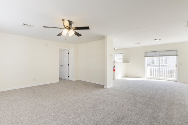 carpeted empty room featuring ceiling fan