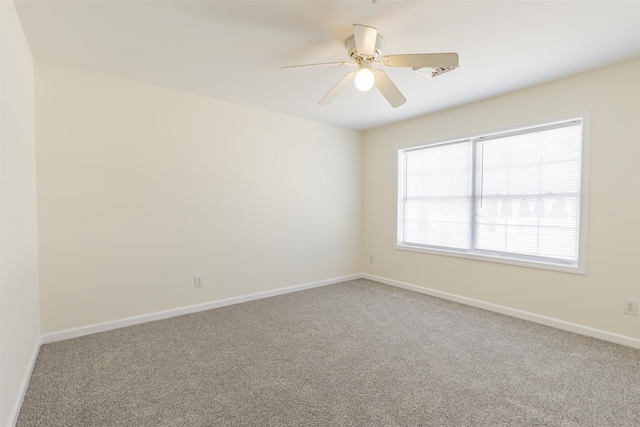 unfurnished room featuring carpet floors and ceiling fan