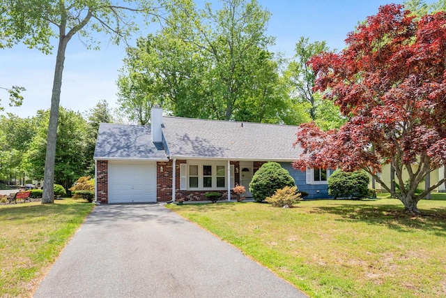 1 Cypress Ct, Rio Grande, NJ 08242 - view of front of property featuring an attached garage, driveway, a front lawn, and a chimney